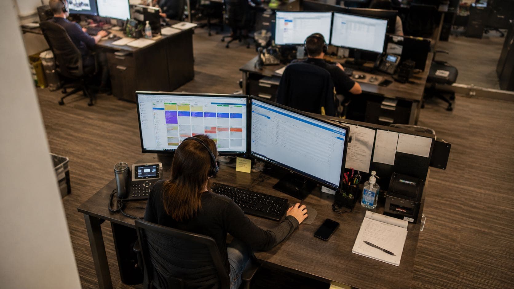 Operations team monitoring live dispatch and scheduling data